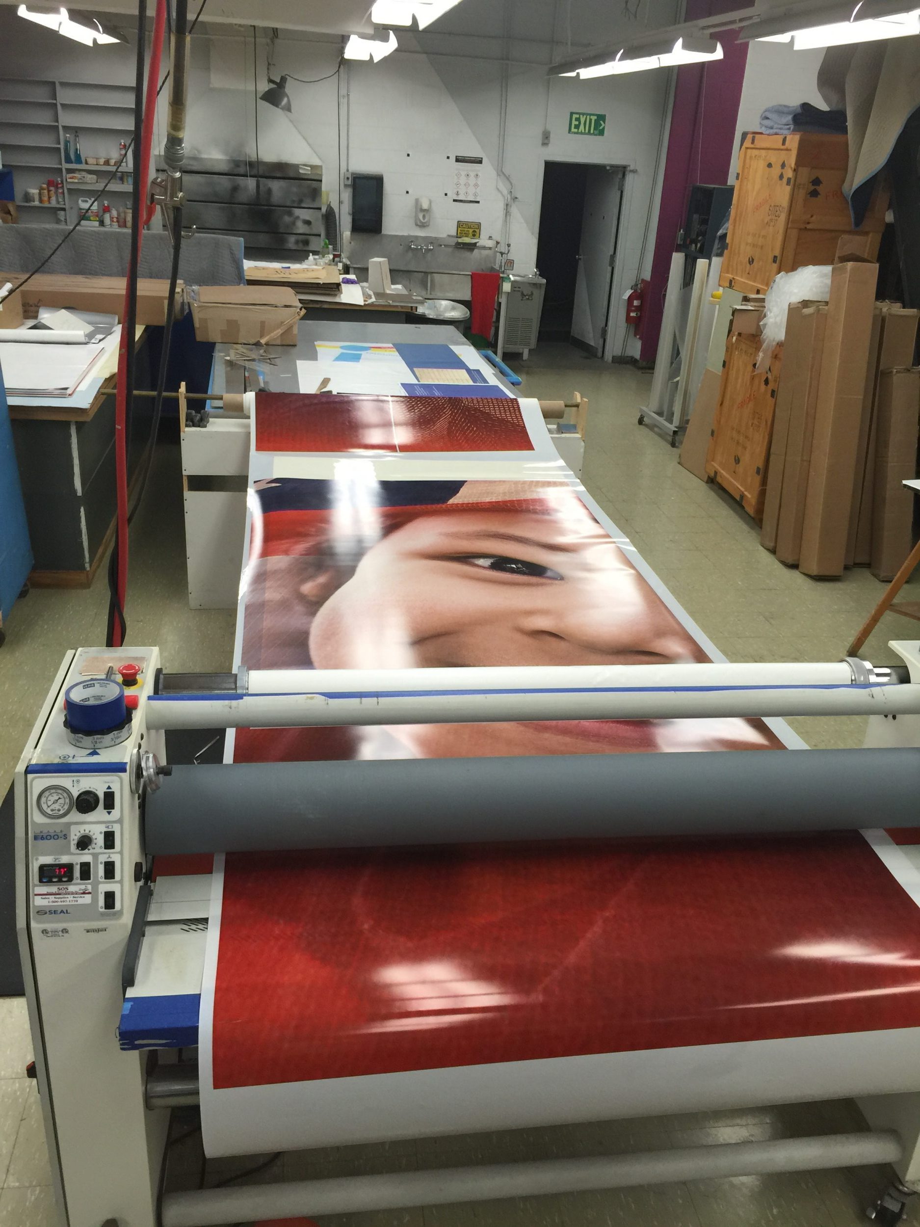 Laminating large window graphics at the Smithsonian Museum of American History.