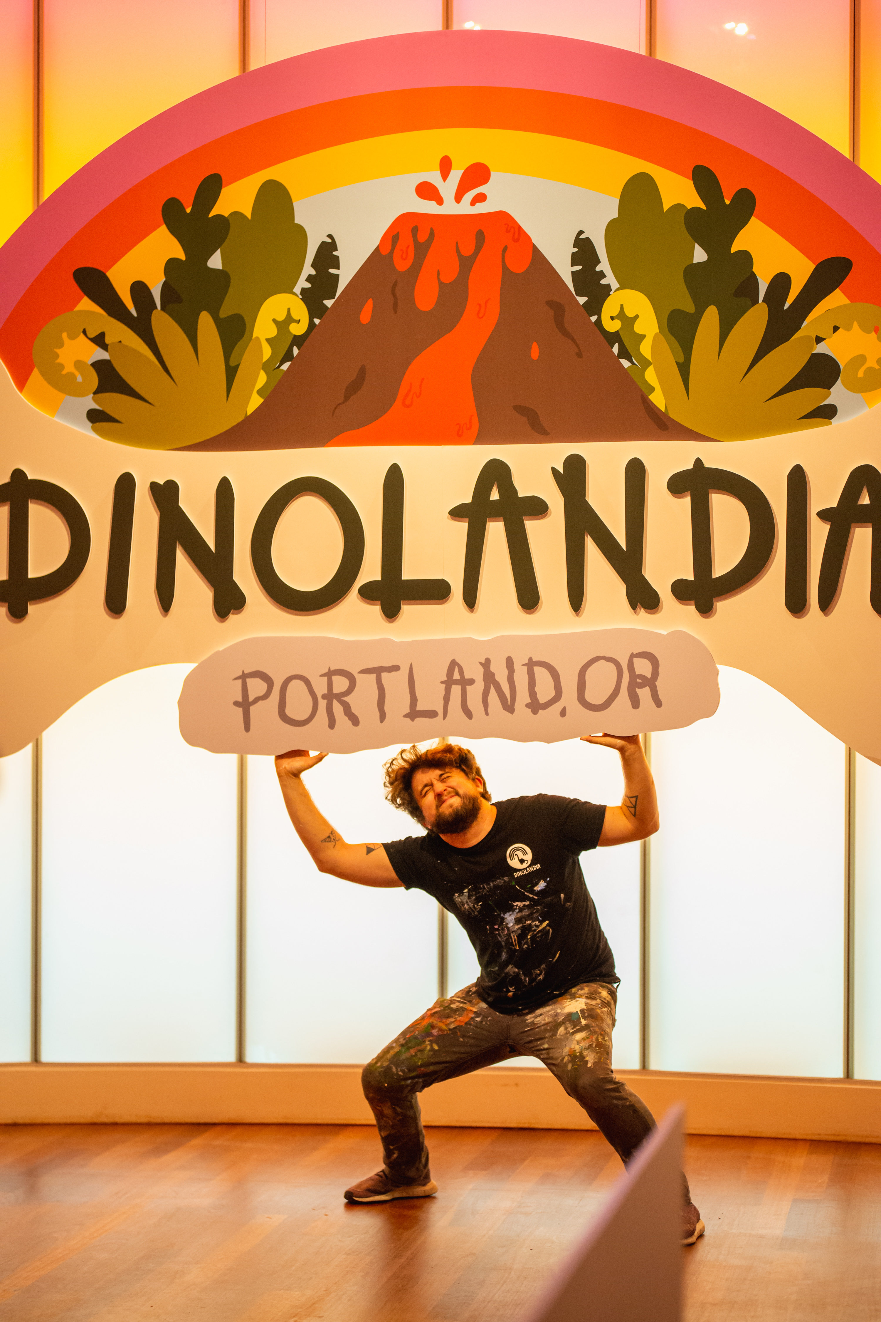 Mike Bennett with the Dinolandia sign created by Infinity Images.